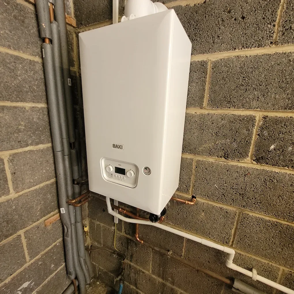 New Baxi boiler installed with neatly clipped and insulated pipework