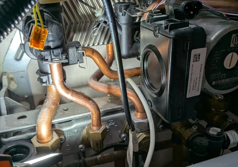 Pump and copper pipework inside a boiler